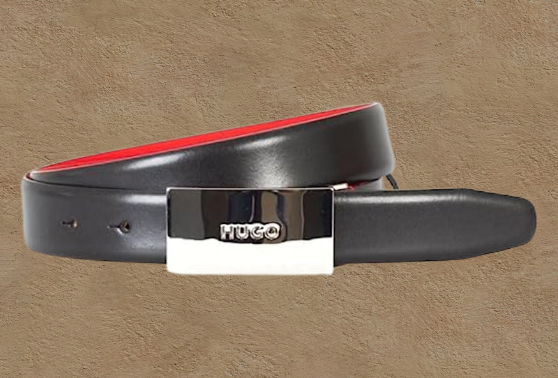 a black leather belt with a red buckle.